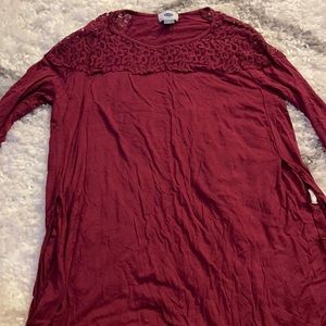Longs sleeve red shirt with open sides.